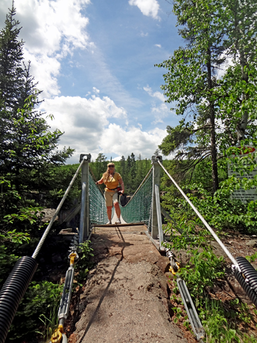 Karen Duquette on the first suspension bridge